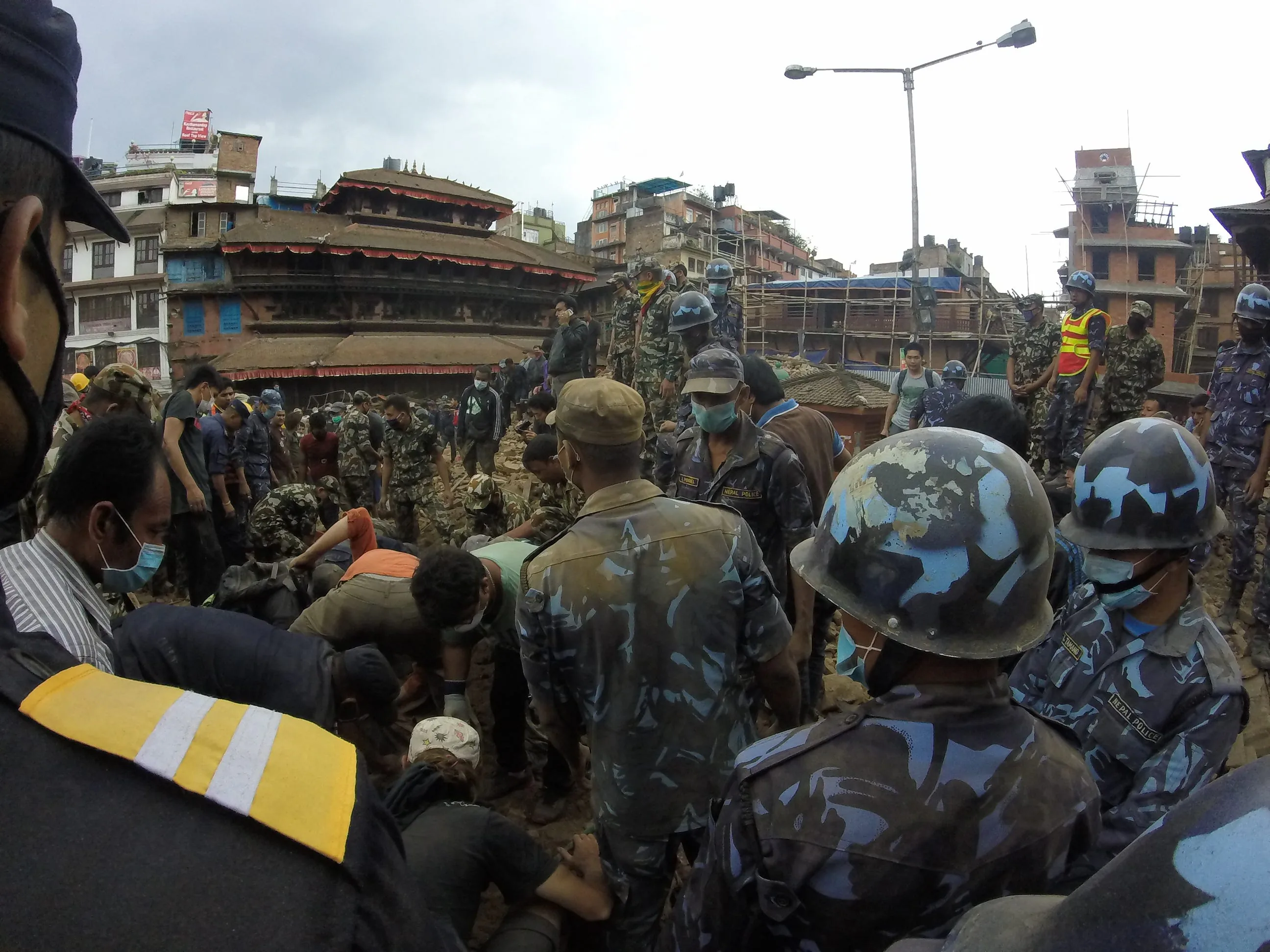 Digging through the rubble because someone “heard a sound” in there
