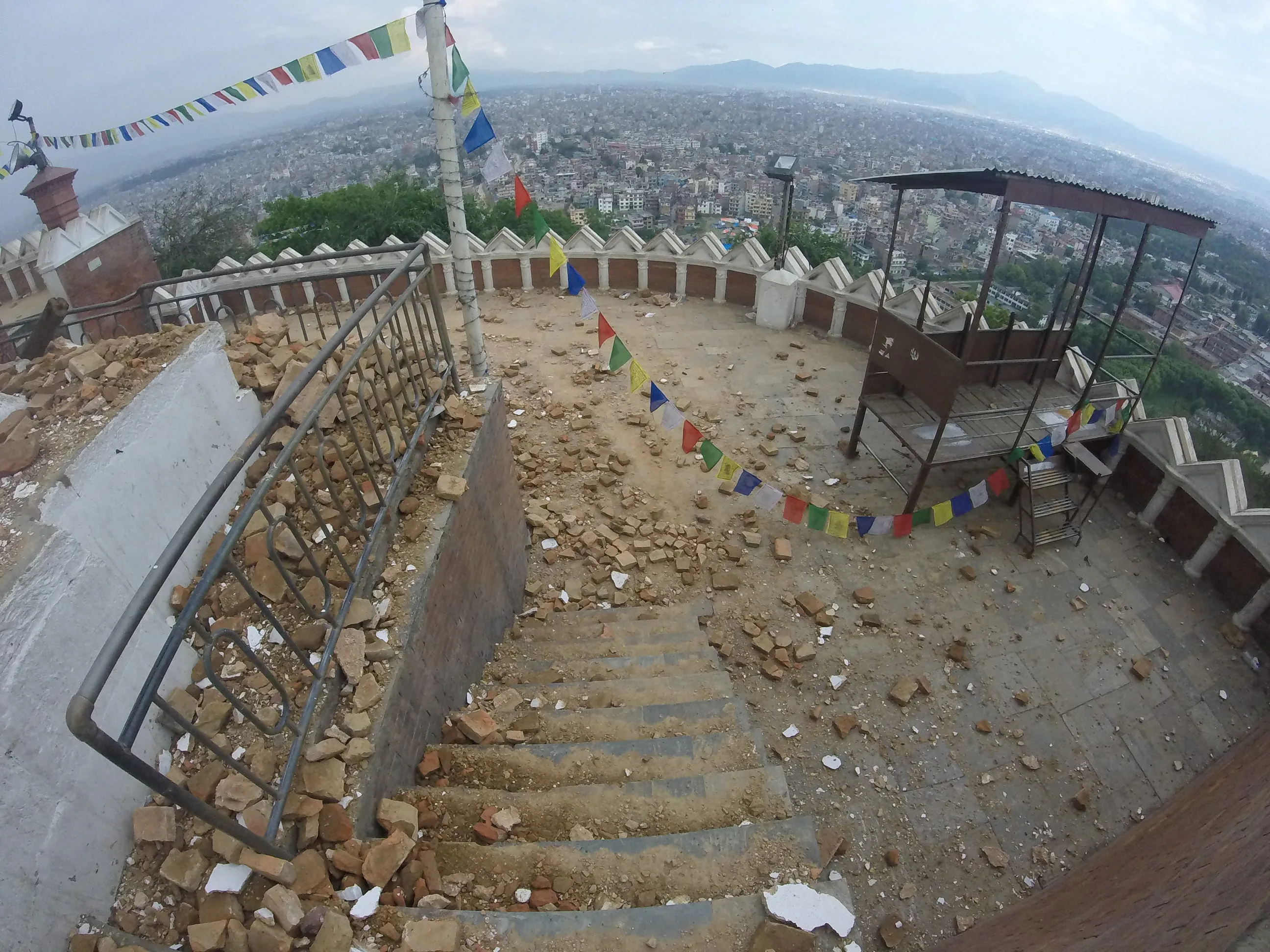 Destruction at Swayambhunath Temple, with Kathmandu in the background