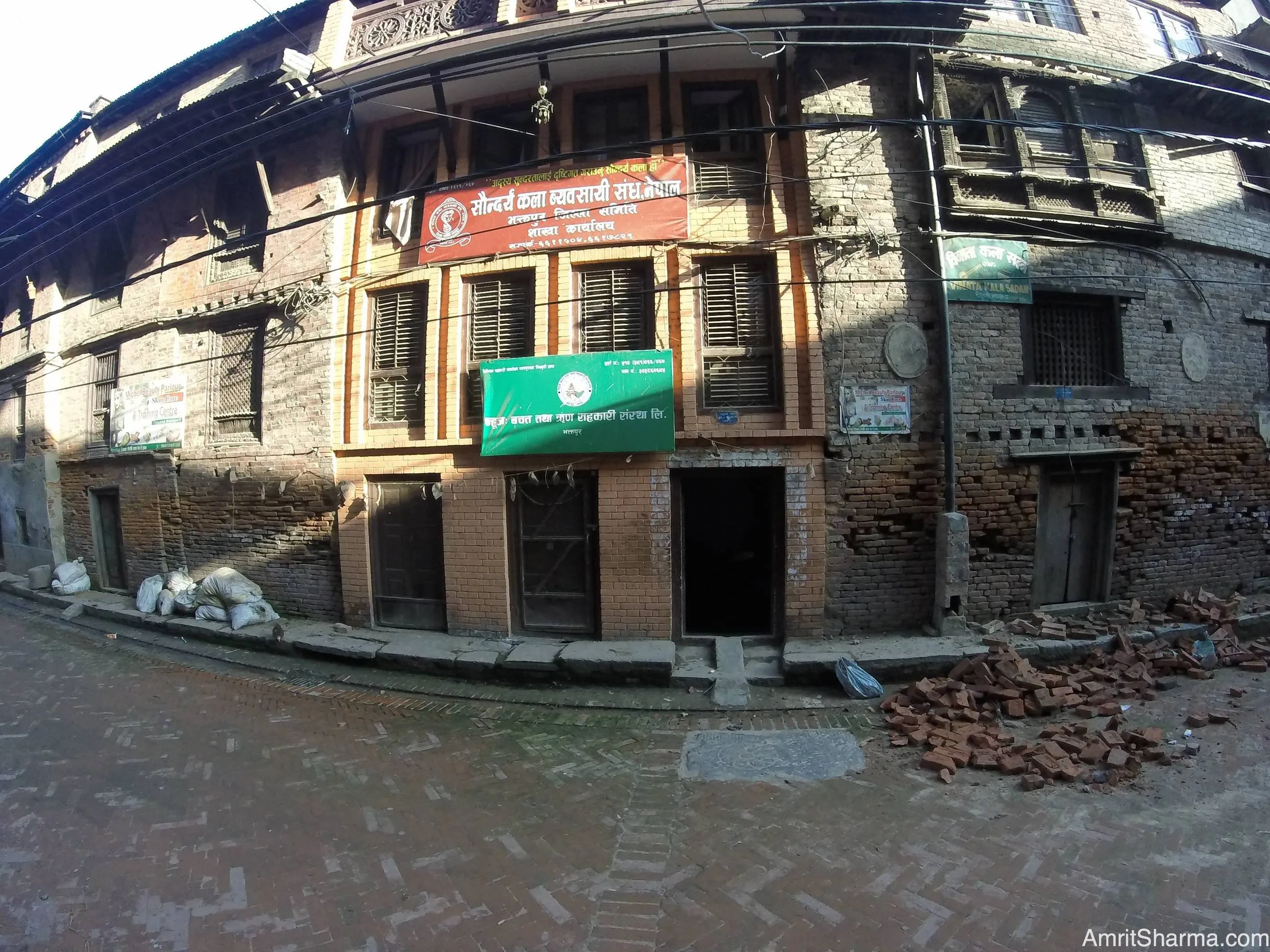 Kedar Machamasi and his neighbors houses looking deceptively undamaged from the street in Bhaktapur