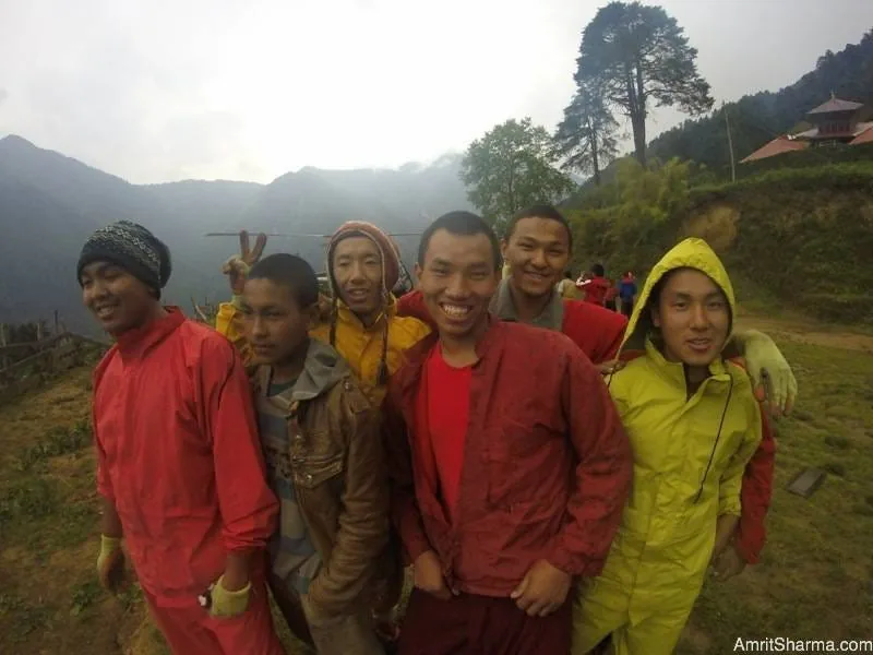 Young boys excited to see the helicopter, but relieved even more so now that they have some food