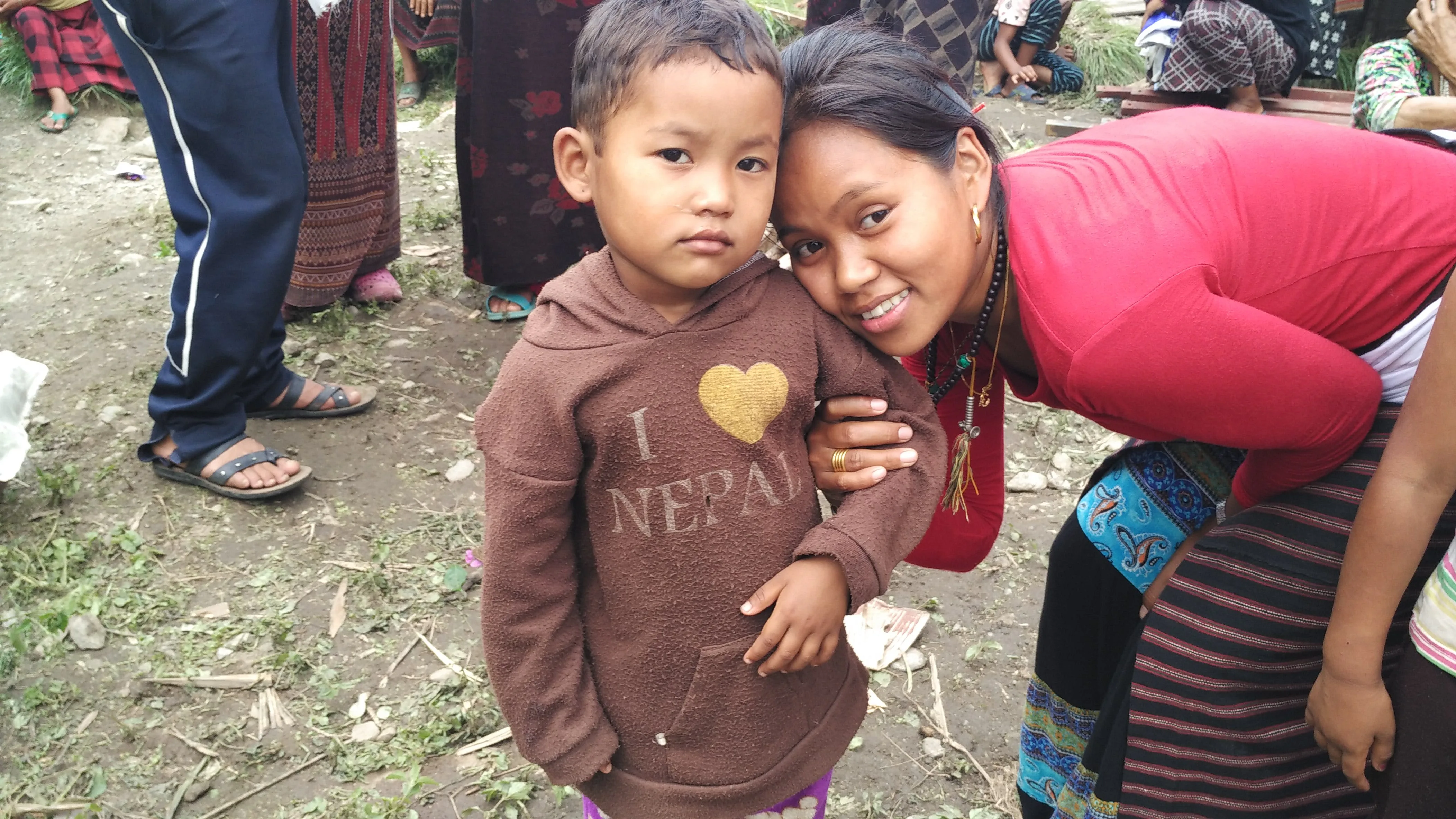 Chandra Maya with a little kid in the morning as we wait for our chopper back to KTM